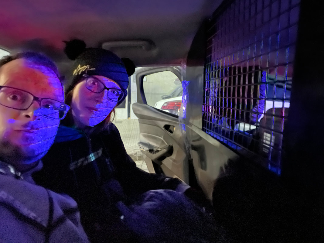 Alan and Katie Donegan in the back of a police car