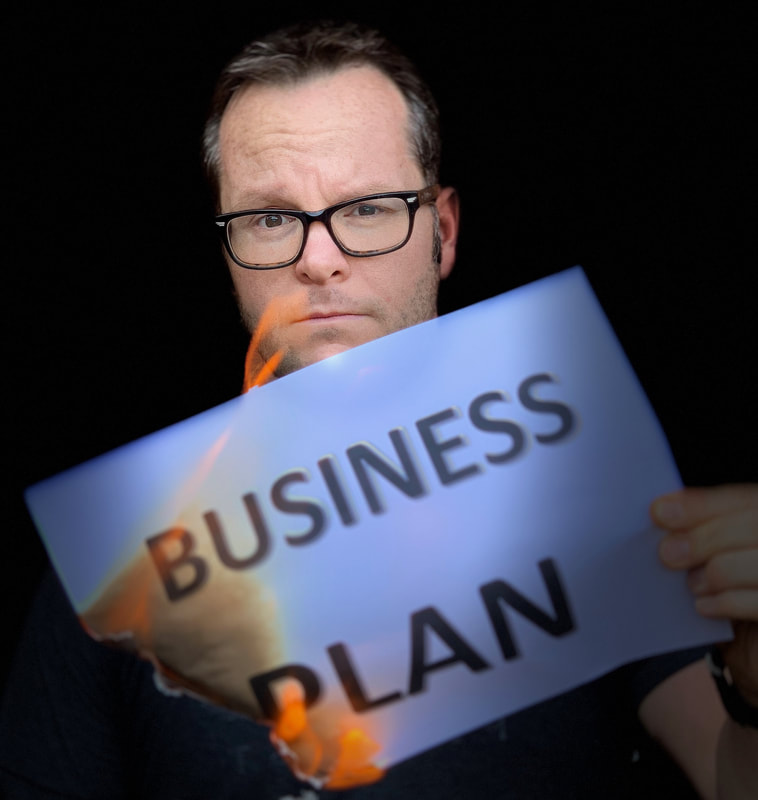 Alan Donegan burning a business plan