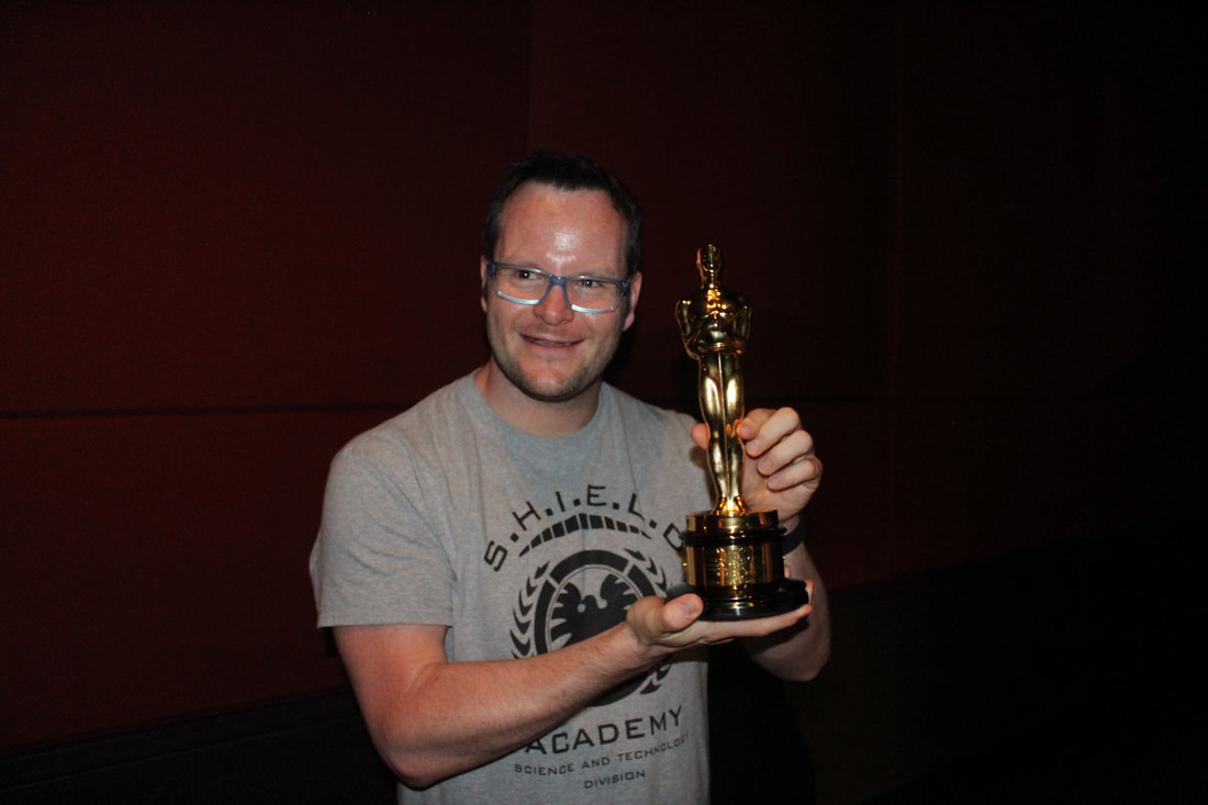Alan Donegan holding an Oscar in Los Angeles in 2016