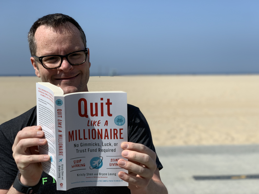 Alan Donegan reading Quite Like A Millionaire by Kristy Shen and Bryce Leung on Santa Monica Beach